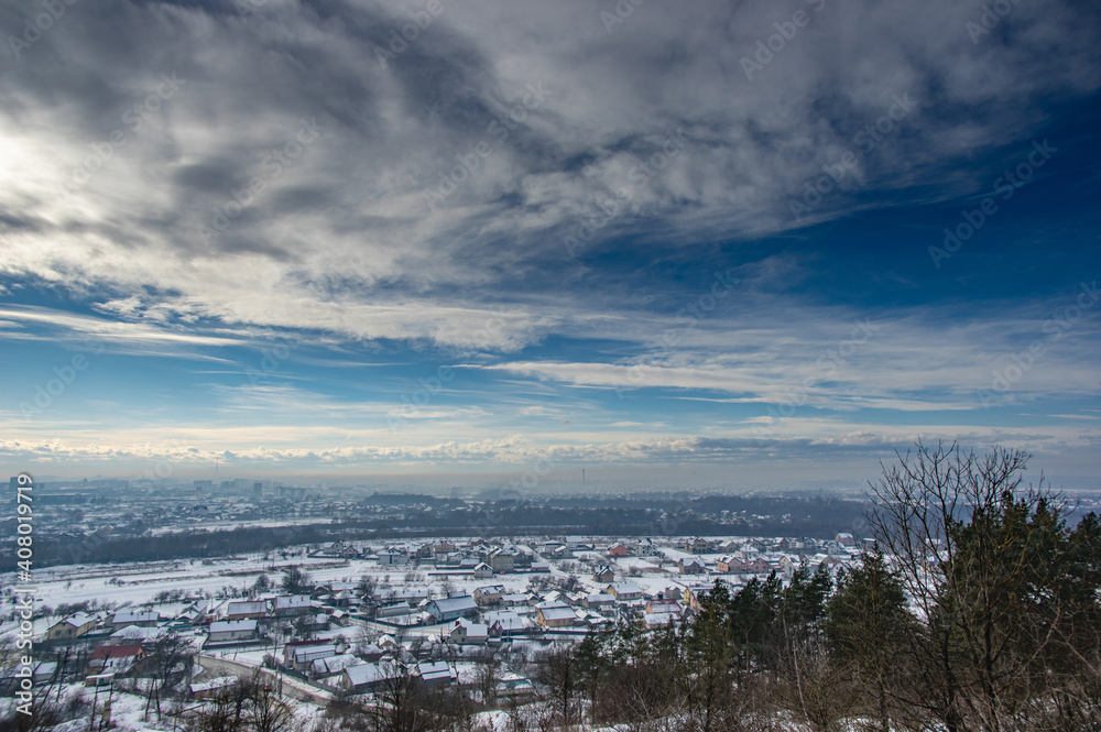 Panorama of a winter European city in the haze