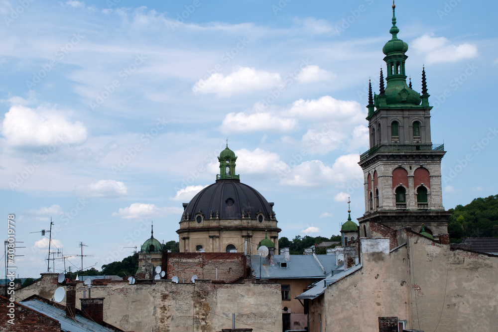 Lviv Ukraine, view across old town rooftops with church domes and satellite dishes