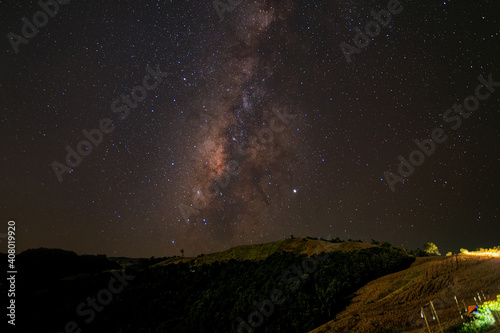 Milkyway galaxy with starlight over the mountain at Nan province ,Thailand. Starlight on the sky at night.