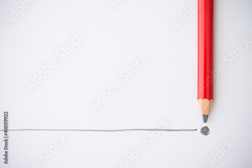 Flat lay of red colour pencil write line and end point on white paper background copy space. Business conclusion, creative idea, imagination and education concept.
