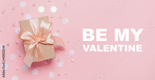 Gifts on pink background, love and valentine concept with text be my Valentine © Daria Lukoiko