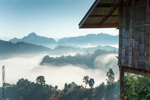 Beautiful mist on the top of mountain in the morning in front of hill tribe hut in Ban Jabo Maehongson, northern Thailand. Travel nature concept. © pla2na