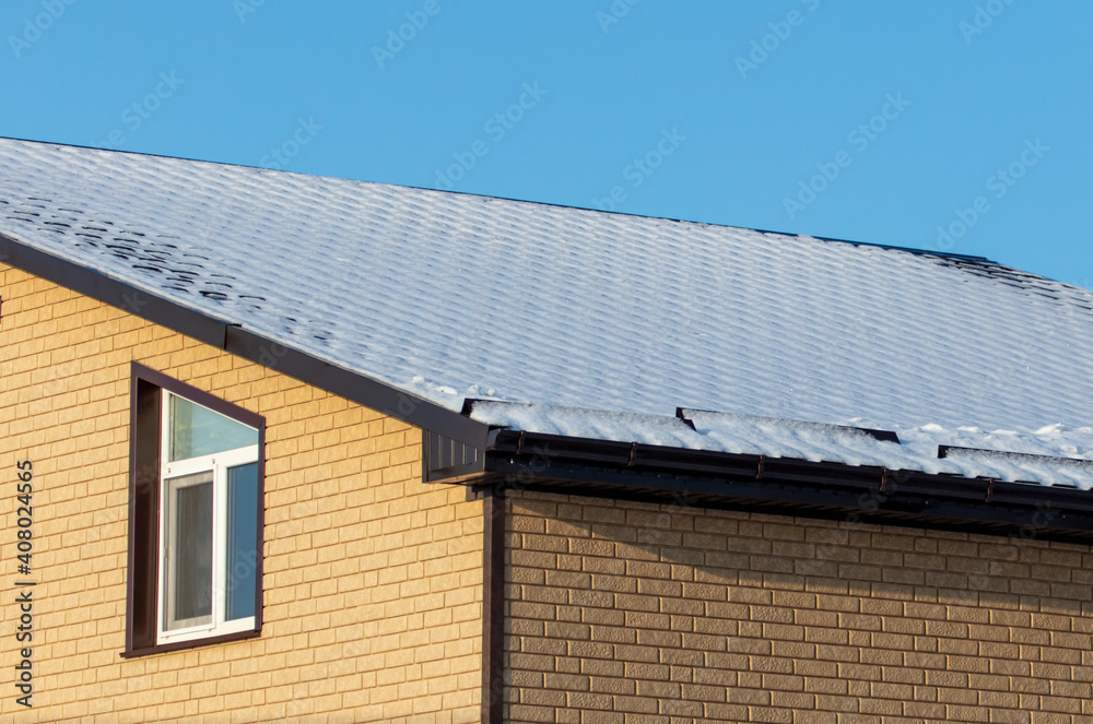 Fototapeta premium Snow on the roof of the house