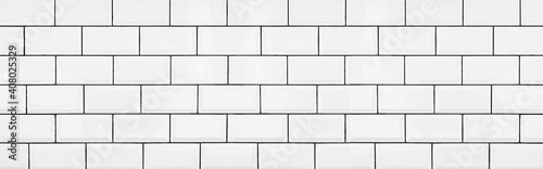 Panorama of Brick pattern white ceramic wall tile texture and seamless background