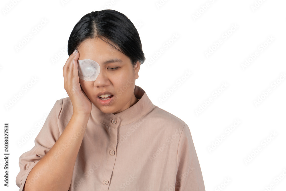 Medicine plaster patch injury wound on woman eye with pain action. Asian woman cover with blindfolded bandaged eye after surgery. Medicine plaster patch injury wound on woman eye with pain action. Asian woman cover with blindfolded bandaged eye after surgery.