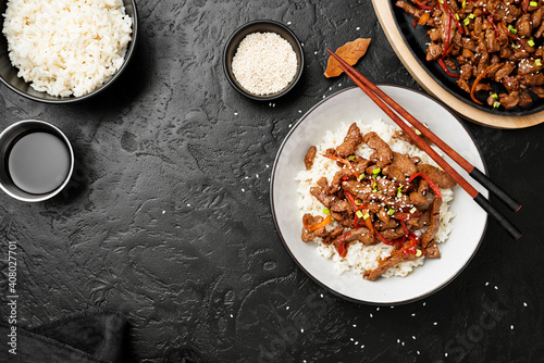 Homemade barbecue korean beef bulgogi with white rice. Top wiev. Black background photo