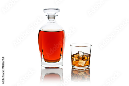 Bottle and glass of scotch whiskey and ice isolated on white background 