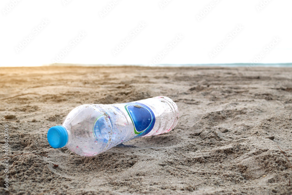 Plastic bottle not decomposed on sand beach background . Nature and ...