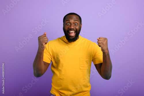 Black man is happy. joyful and happiness expression. Purple background