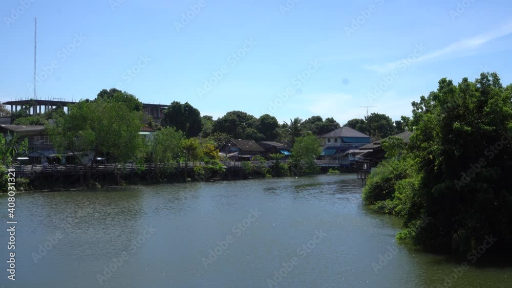 Landscape of Chanthaburi waterfront view of wooden houses near Chanthaburi river with community building located on side of Chanthaburi River, village of tourist traditional in travel Landscape of Chanthaburi waterfront view of wooden houses near Chanthaburi river with community building located on side of Chanthaburi River, village of tourist traditional in travel