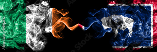 Republic of Ireland, Irish vs United States of America, America, US, USA, American, Wyoming smoky mystic flags placed side by side. Thick colored silky abstract smoke flags.