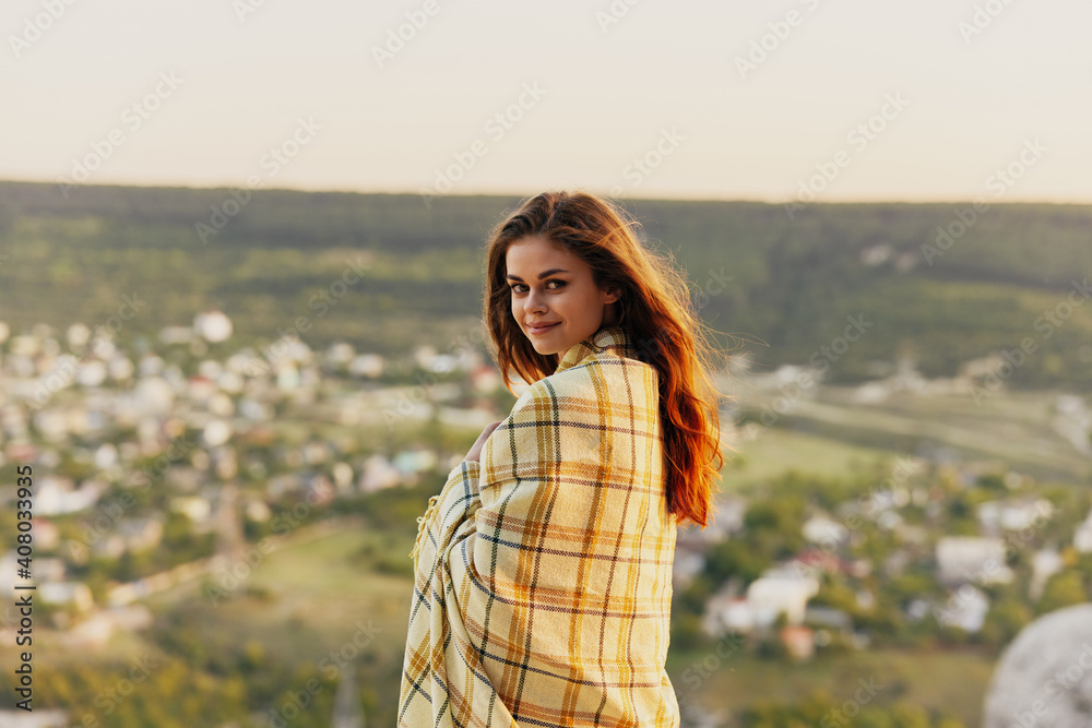 beautiful woman with fred on nature in the mountains smiling model side view beautiful woman with fred on nature in the mountains smiling model side view