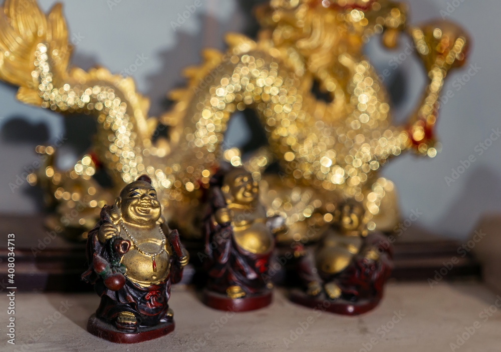 Fototapeta premium Chinese gold dragon statue with Buddhas