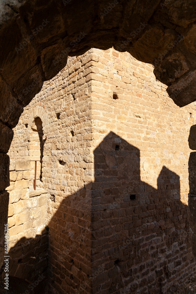 Shadows and arch in the medieval Castle of Loarre, Aragonese castle from the 11th and 12th century, Romanesque architectural style, Huesca province, Aragon, Spain, Europe.