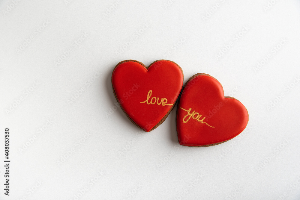 Two red hearts with the words Love you on white background, top view. Valentines day Two red hearts with the words Love you on white background, top view. Valentines day