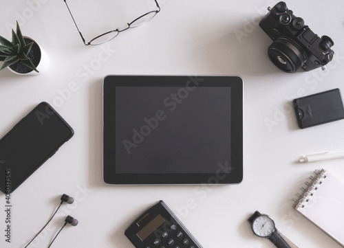 top view of office desk table with tablet and smartphone on white background, graphic designer, Creative Designer concept.