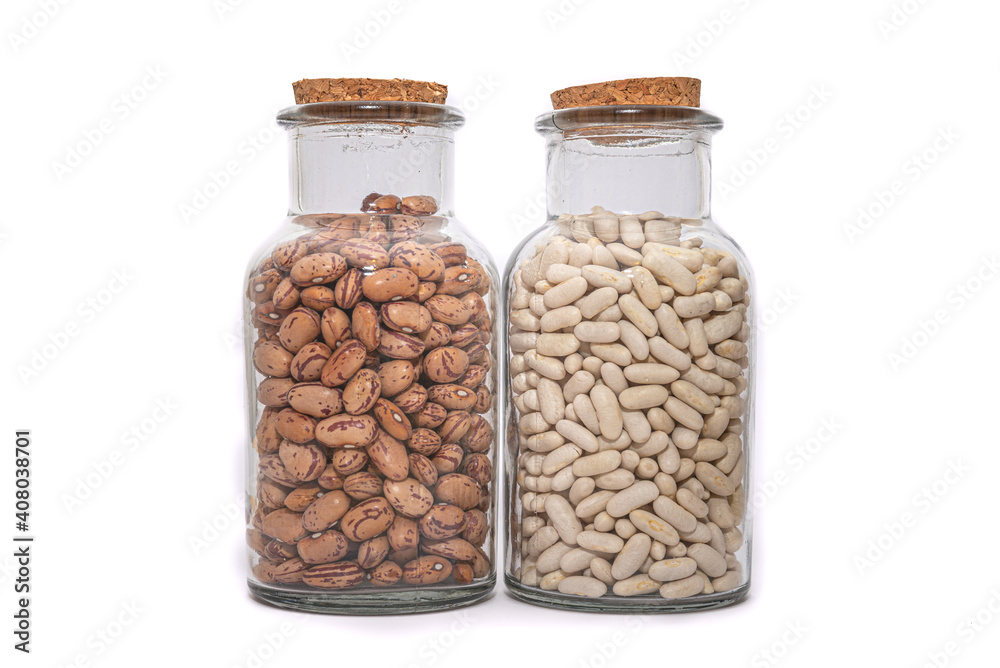 White Beans And Borlotti Bean dried and preserved in glass jars isolated on a white background. Healthy nutritional preserved ingredients. White Beans And Borlotti Bean dried and preserved in glass jars isolated on a white background. Healthy nutritional preserved ingredients.