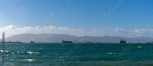 freight ships and container ships in the Bay of Gibraltar waiting to unload cargo