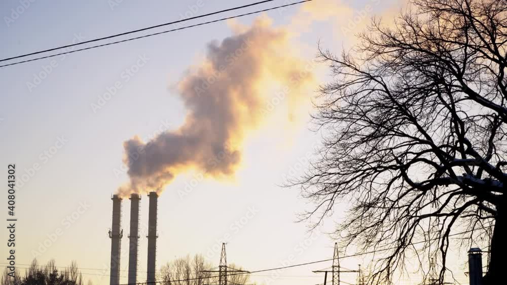 Smoke comes from the pipes of the boiler room. Pipe of hydroelectric