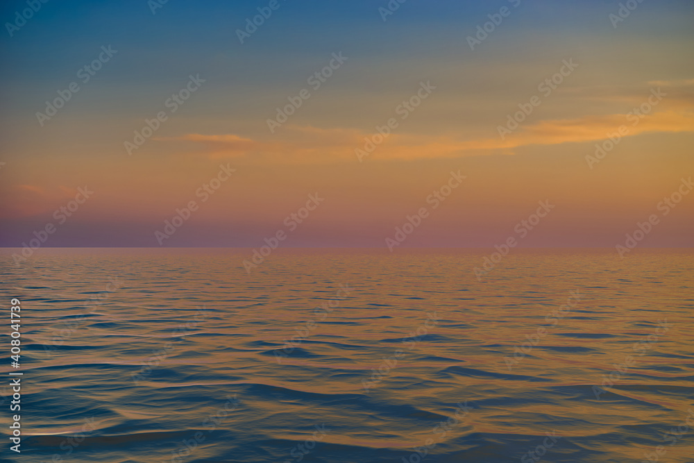 bright sunset over the blue sea with shimmering different colors in the clouds