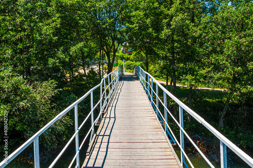 Fototapeta Naklejka Na Ścianę i Meble -  small bridge with a metal railing over a mountain river