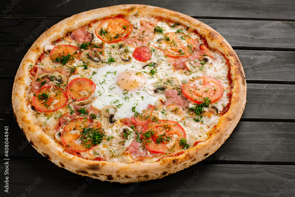 Fresh carbonara pizza with scrambled egg on wooden background