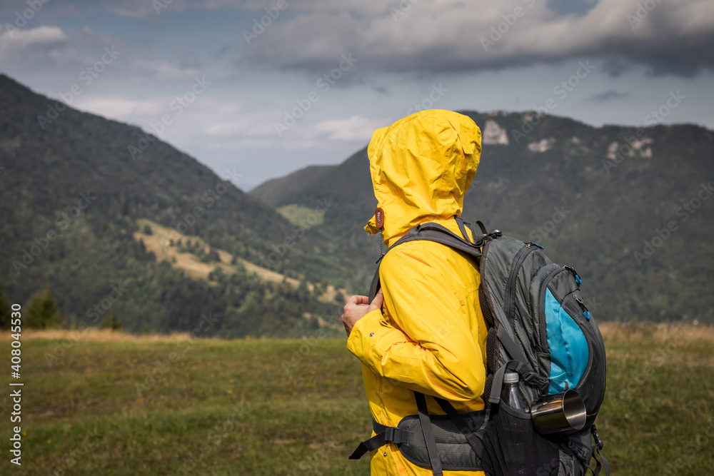 Hiking in mountains. Active lifestyle. Woman with backpack trekking in natural parkland Mala fatra, Slovakia