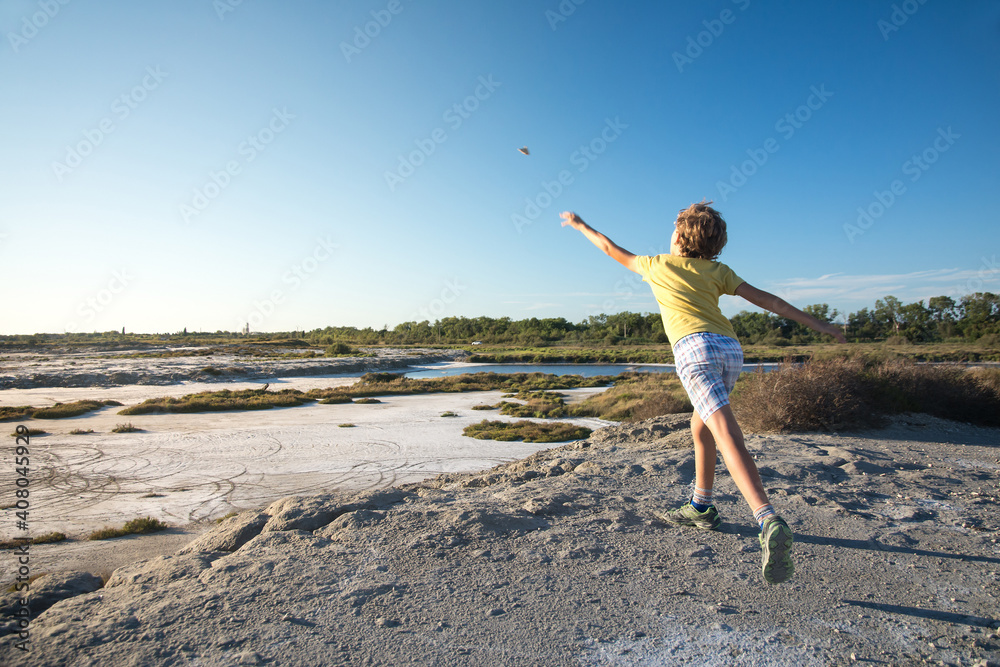 Child throws a stone