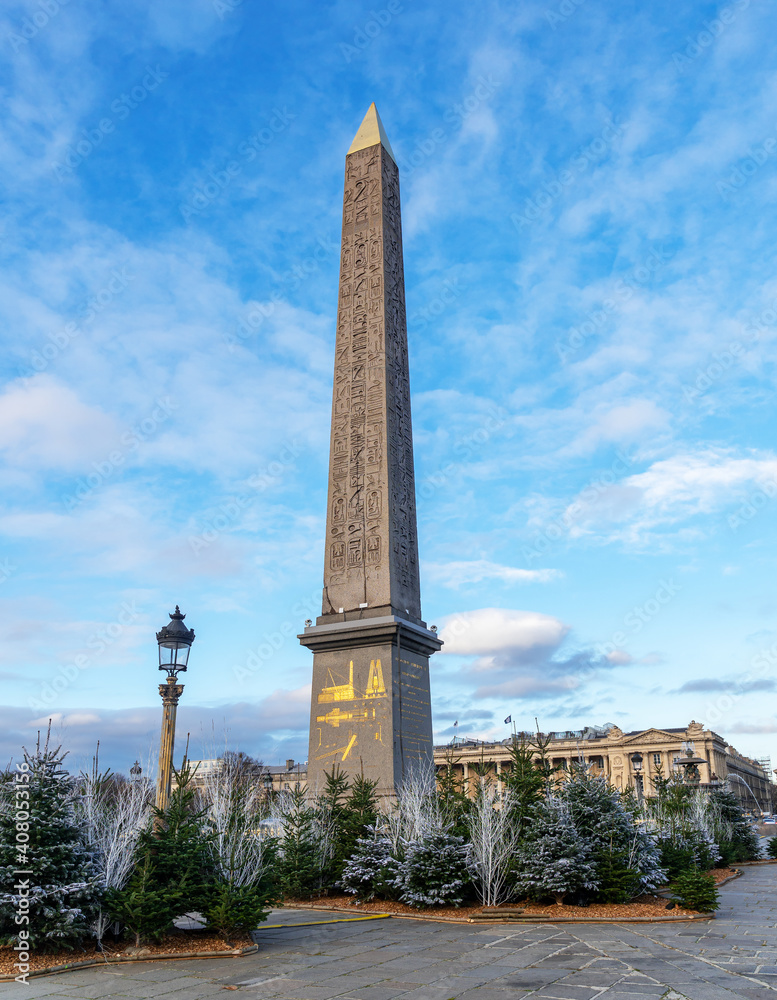 Christmas trees at the bottom of the Obelisk monument at Place de la concorde in December 2020 - Paris, France
