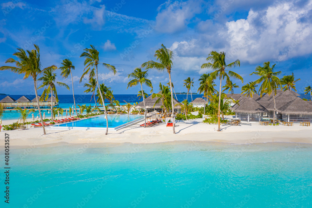 Aerial photo of beautiful Maldives paradise tropical beach. Amazing view, blue turquoise lagoon water, palm trees and white sandy beach. Luxury travel vacation destination. Sunny aerial landscape Aerial photo of beautiful Maldives paradise tropical beach. Amazing view, blue turquoise lagoon water, palm trees and white sandy beach. Luxury travel vacation destination. Sunny aerial landscape