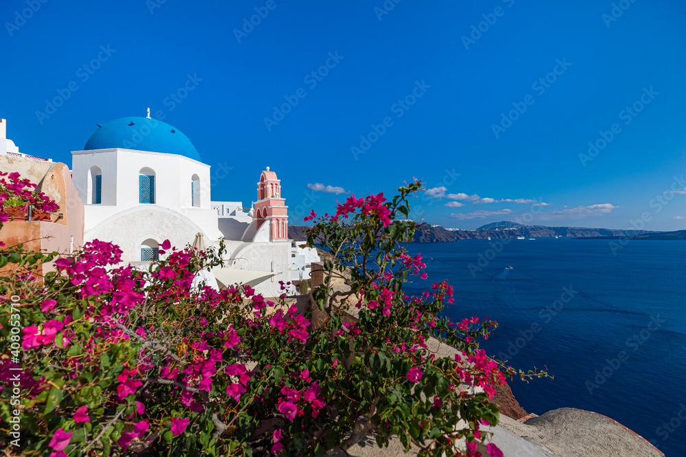 Fototapeta premium Santorini island, Greece. Amazing summer vacation landscape, white architecture and blue sea view over the caldera. Famous travel destination, urban travel background. Leisure lifestyle travelling