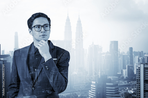 Photography Young handsome businessman in suit and glasses dreaming about new career opportunities after MBA graduation