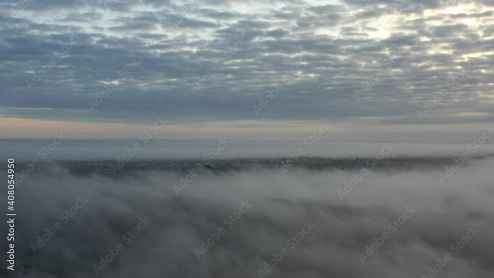 Heavy fog over the Nevezis river in Kaunas county, Lithuania. Drone aerial view. Autumn morning Heavy fog over the Nevezis river in Kaunas county, Lithuania. Drone aerial view. Autumn morning