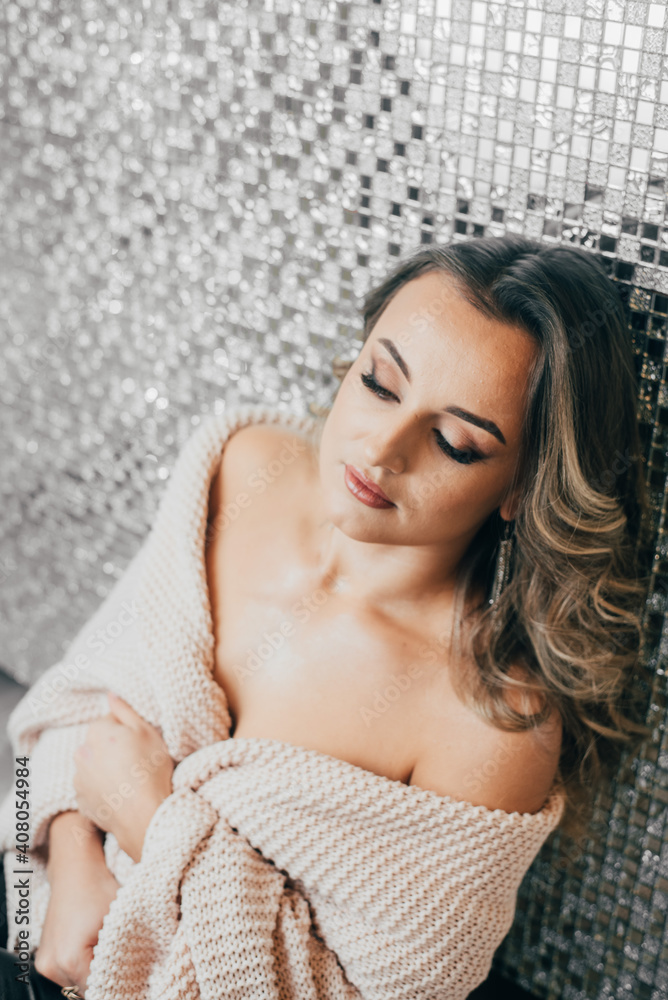 Fototapeta premium Portrait of a very beautiful girl with makeup and studio light