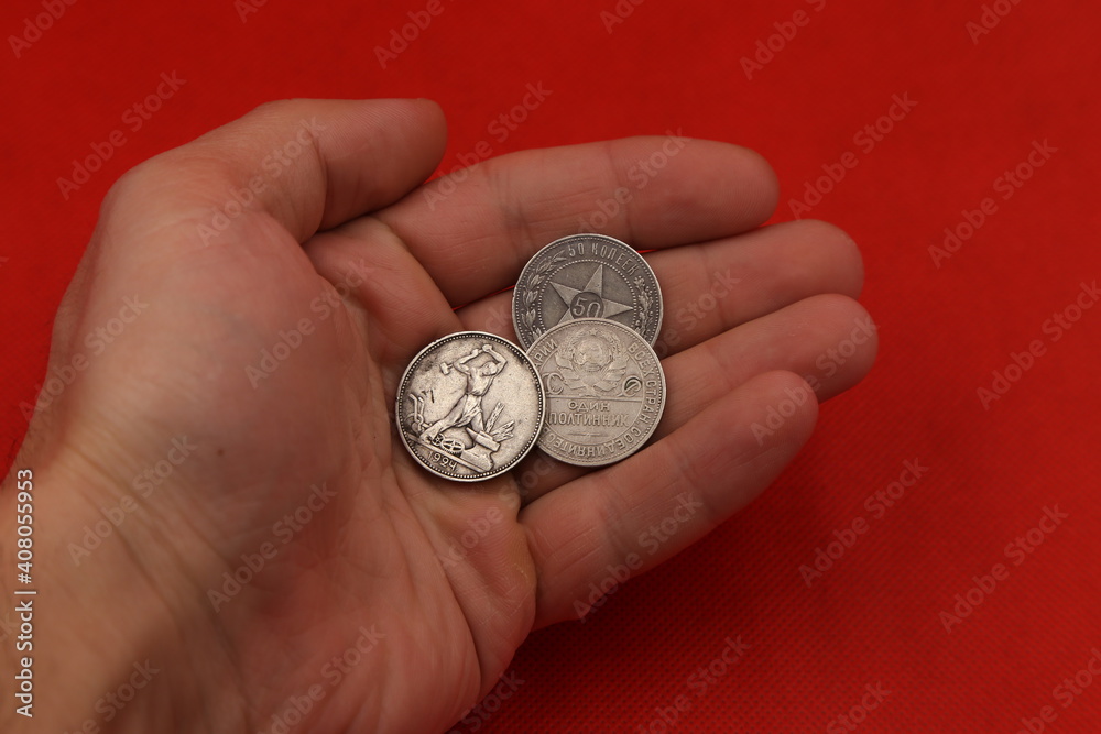 Old Russian silver coins in hand Old Russian silver coins in hand
