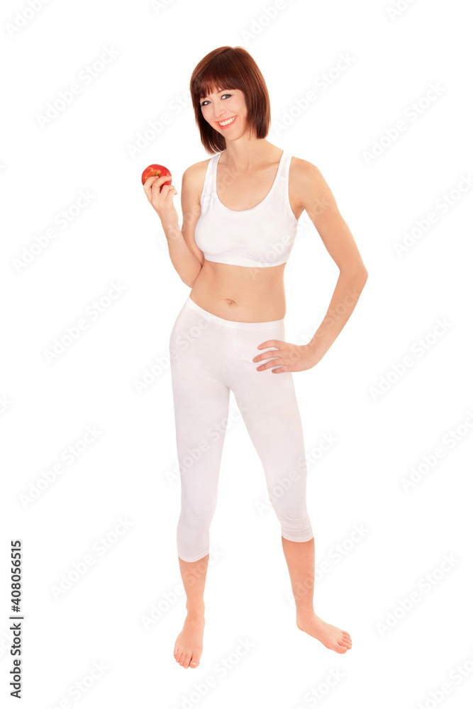 Full length portrait of an athletic young woman holding an apple, isolated on white studio background Full length portrait of an athletic young woman holding an apple, isolated on white studio background