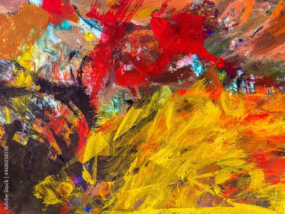 Abstract texture with yellow, red, black tempera paints on the palette.