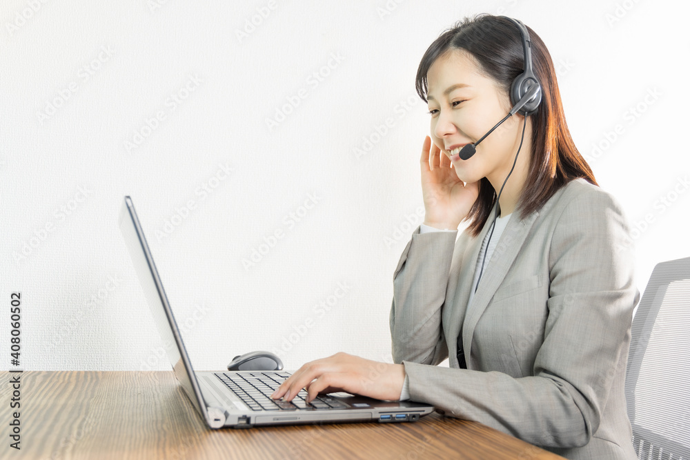 Woman wearing a headset and having a web conference Woman wearing a headset and having a web conference