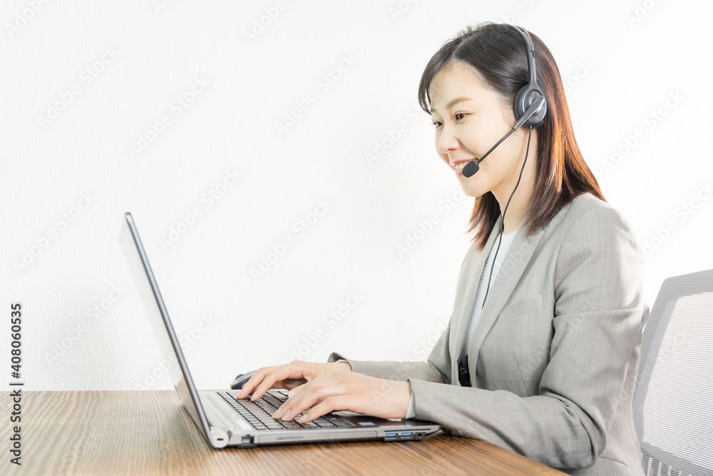 Woman wearing a headset and having a web conference Woman wearing a headset and having a web conference