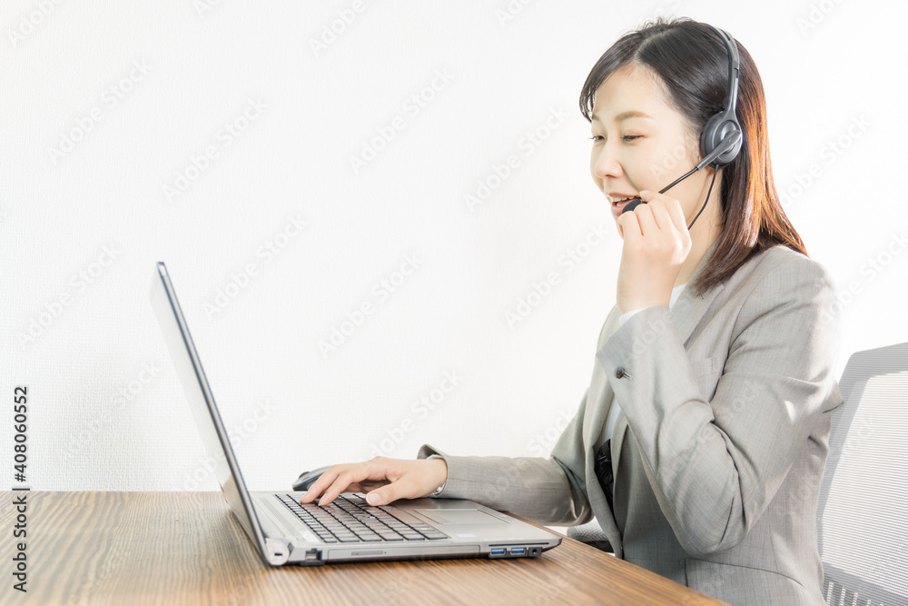Woman wearing a headset and having a web conference Woman wearing a headset and having a web conference