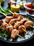 Skewers - grilled pork meat with vegetables on wooden background table
