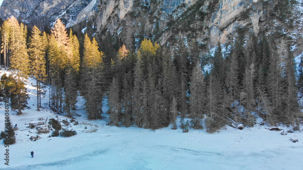 Braies Lake blotted in winter, aerial view from drone, Italian Alps