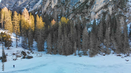 Braies Lake blotted in winter, aerial view from drone, Italian Alps