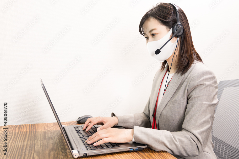 Woman wearing a headset with mask and having a web conference Woman wearing a headset with mask and having a web conference