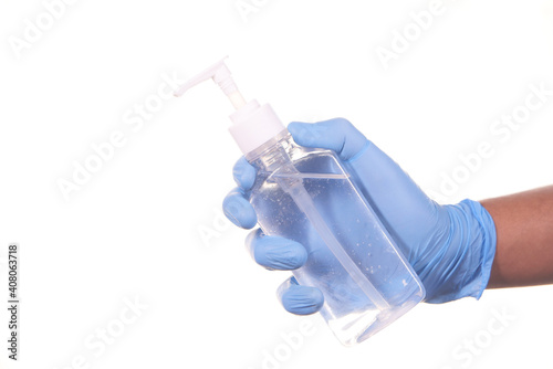 man hand in medical gloves holding sanitizer gel for preventing virus 