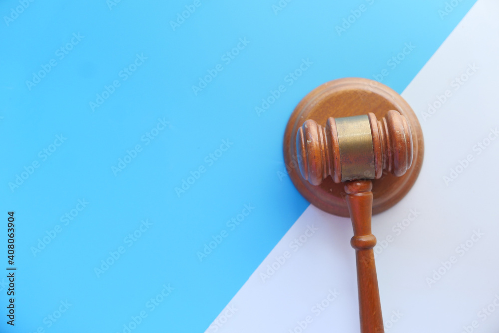 Top view of gavel on color background with copy space Top view of gavel on color background with copy space
