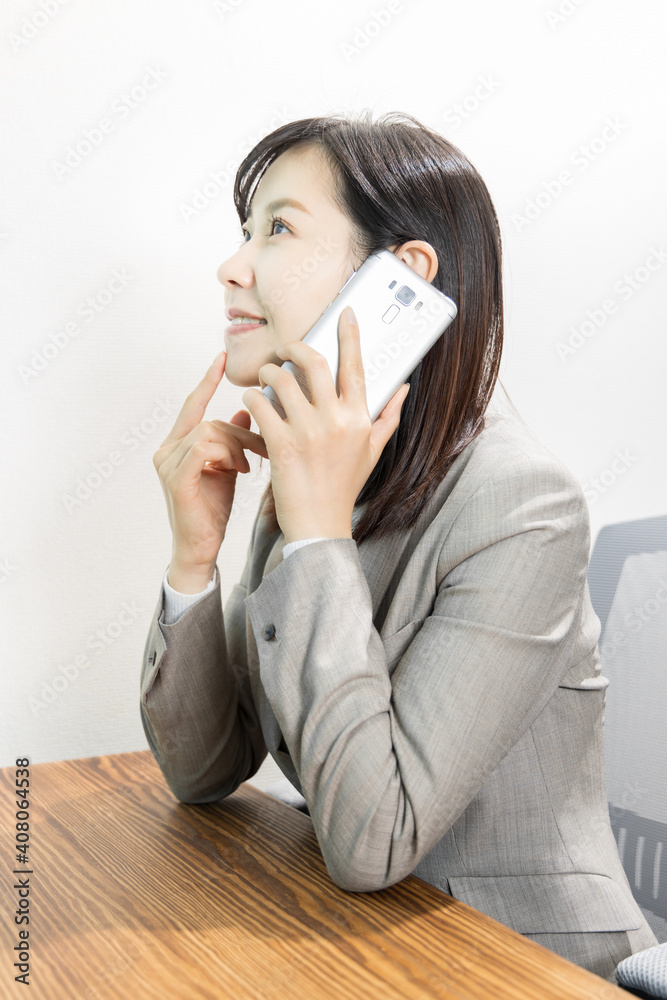 Woman making a work call on a mobile phone Woman making a work call on a mobile phone