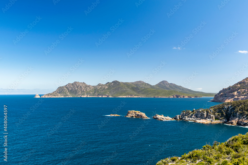 Stunning panoramic view of Freycinet Peninsula, East Coast Tasmania, Australia, seen from Cape Tourville Lighthouse. Mount Graham and Mount Freycinet are the two highest peaks in the background.