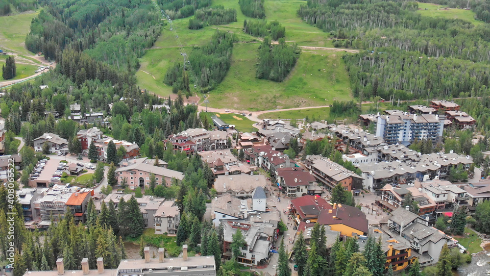 Vail city center and surrounding mountains, Colorado. Aerial view from drone in summer season