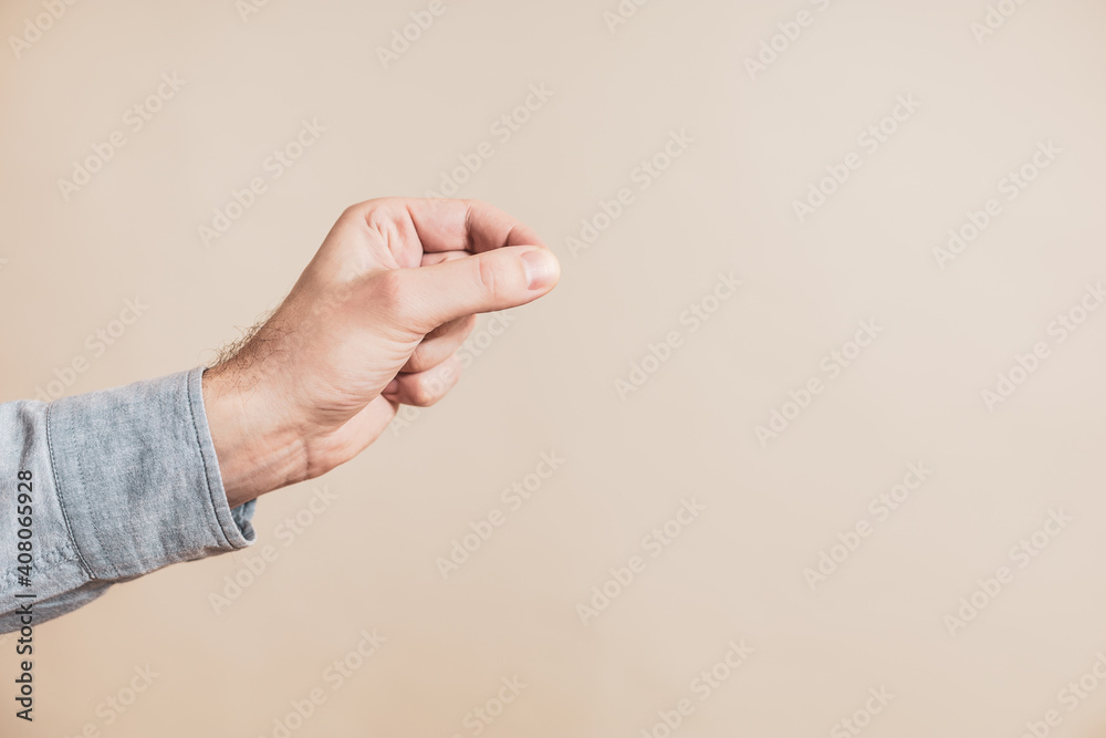 Close up image of male hand in picking gesture. Close up image of male hand in picking gesture.